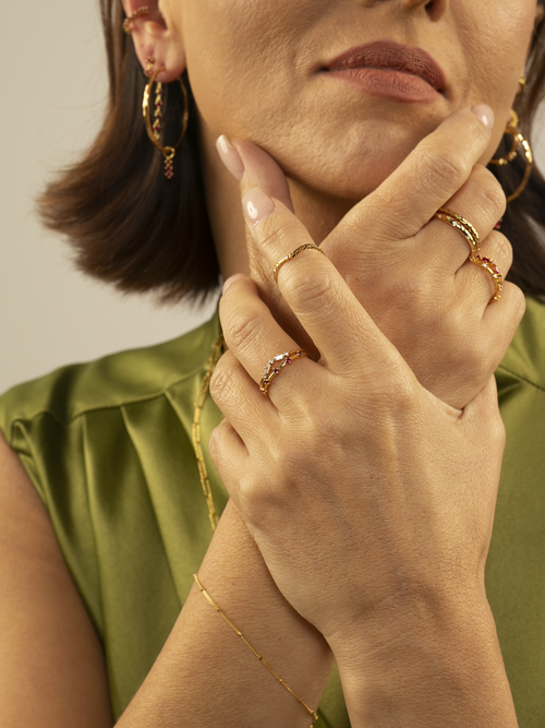 Lara wearing Astra Ruby Ring in Gold Vermeil and other ring stack