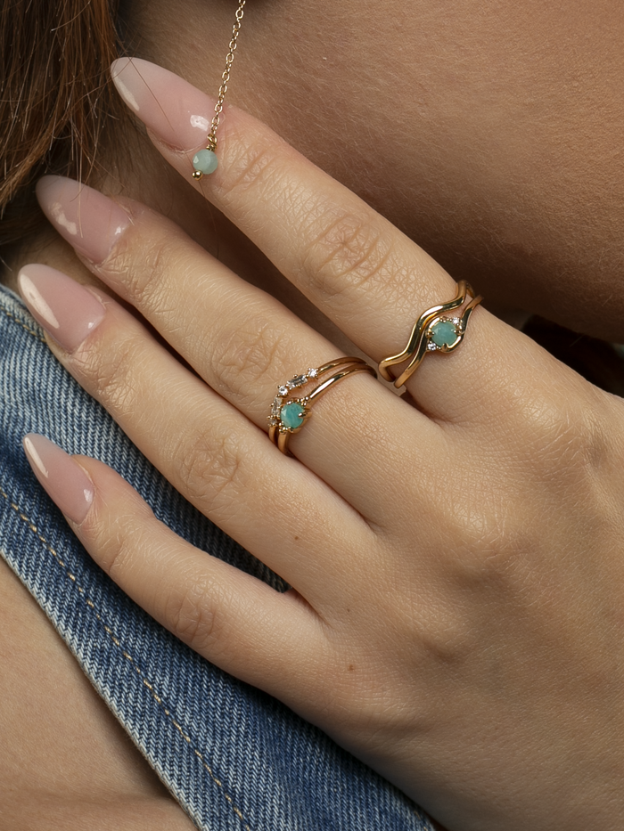 Angele wearing Diamond wishbone, Rive, Onda and Wave rings from L'ERA Jewellery